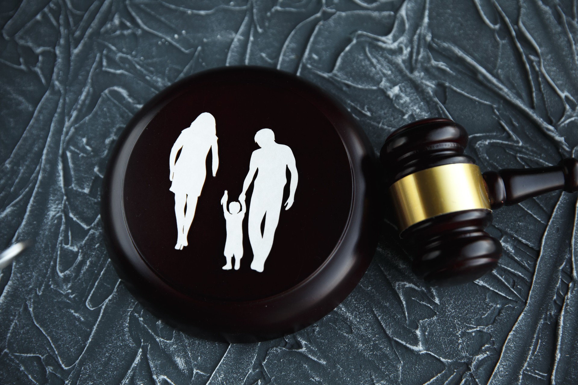 Cutout family and colourful letters regarding child-custody and family-law concep